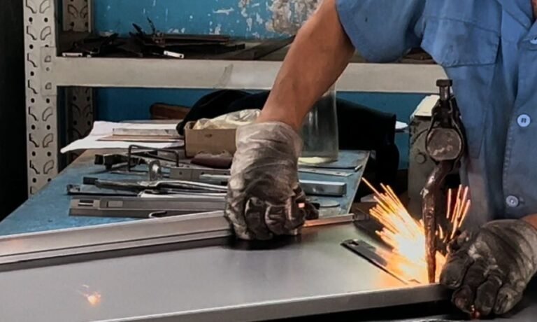 Worker Performing Manual Spot Welding